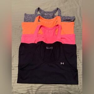4 Under Armour women’s heat gear Tank Tops.